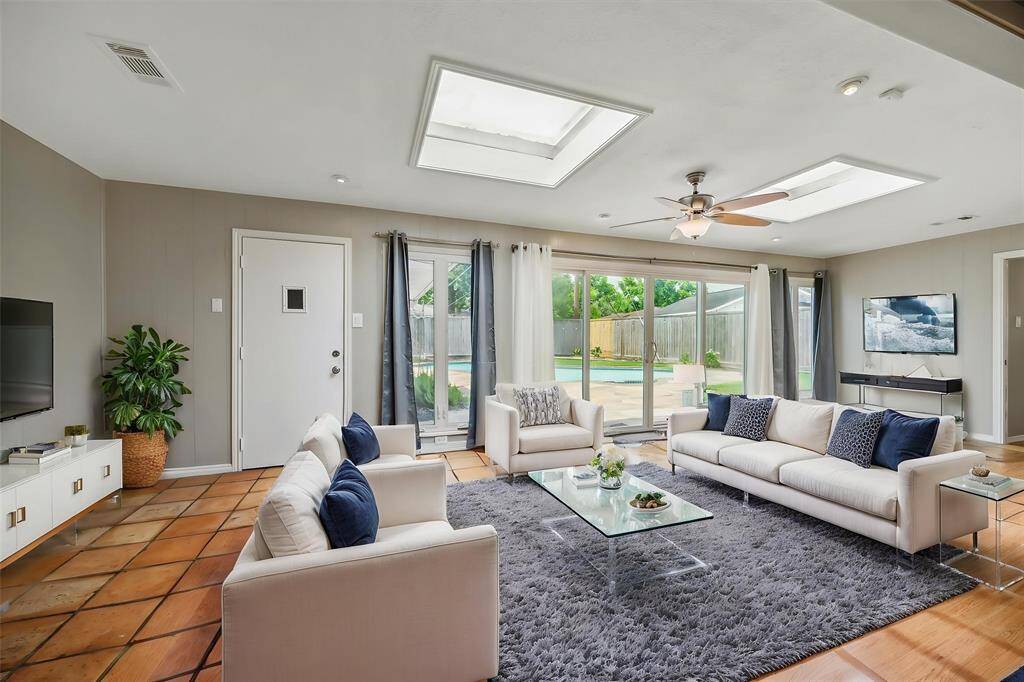 The back sunroom is big enough to make it a sitting room or a sitting room and eating area.