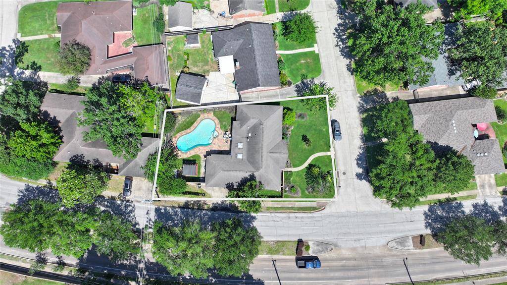 The neighborhood is filled with mature trees, the neighborhood has great curbs, speed bumps, and drainage. Utility lines are fun behind the homes. The home is white boxed. You can see the parking of cars on streets and in driveways isn't heavily done in this neighborhood.