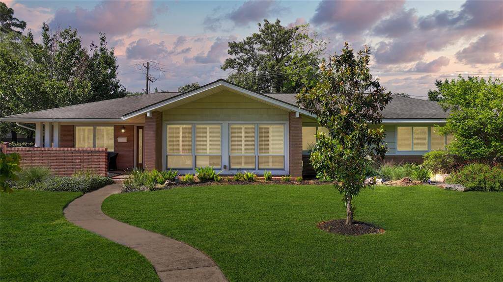 Live in drive less. This home is only 7 miles from downtown and zoned to Memorial Highschool. The home sits on a large lot with mature trees, ranch style, with original unpainted brick.