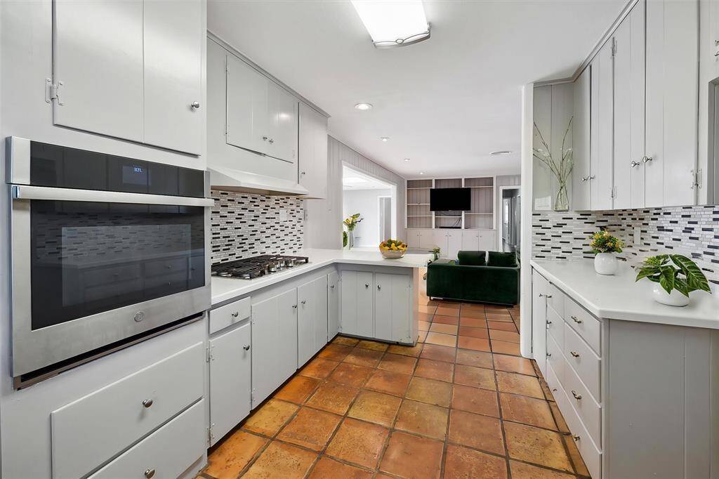 The kitchen is open to the family room pictured. Same beautiful Saltillo tile throughout common areas.