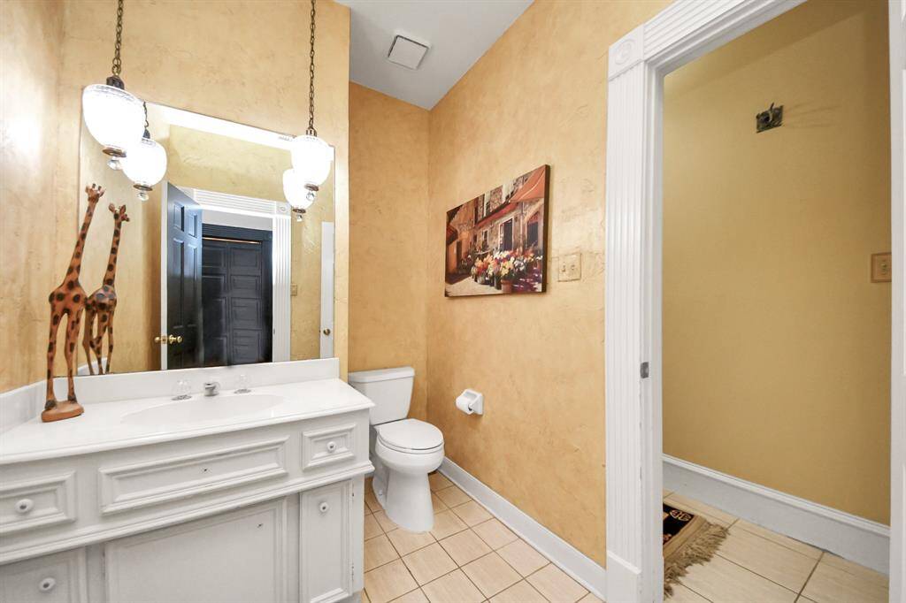 Conveniently located near the kitchen and family room, this stylish half bath is perfect for guests and everyday living.