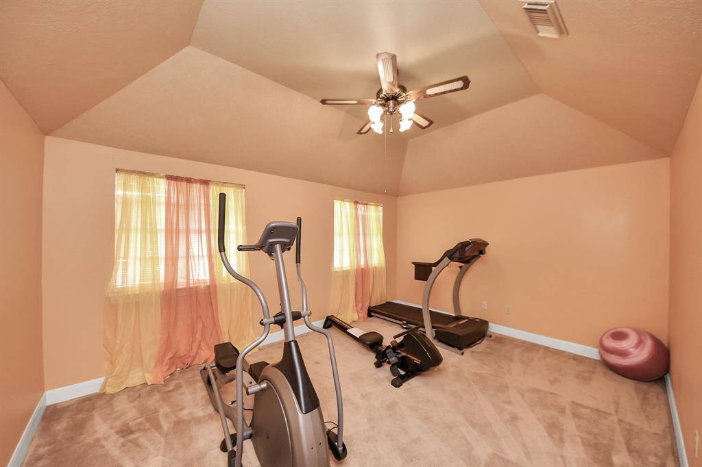 One of six total bedrooms - currently set up as a home gym.