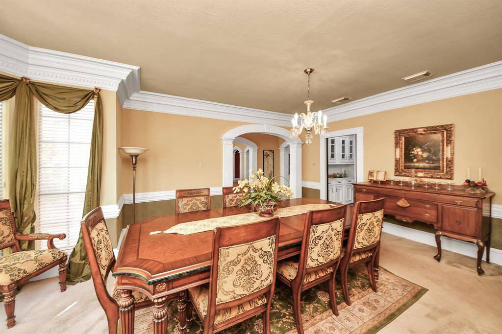 The formal dining room faces the front of the property and it's located right off the butlers pantry.