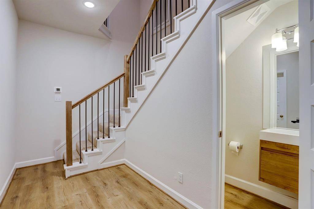 Laundry area with washer and gas dryer hookups in a convenient spot near the kitchen and pantry.