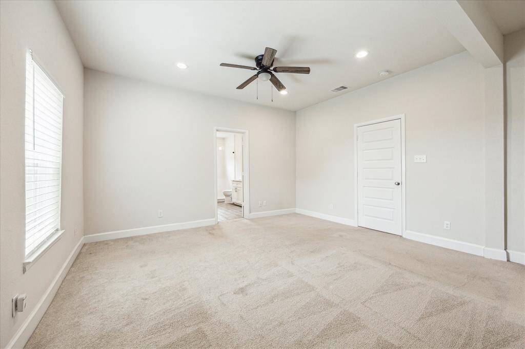 Spacious primary suite with natural light and peaceful views.