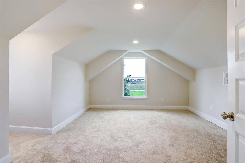 Efficiently designed upstairs bedroom with dormer alcove—ready for your custom closet solution.
