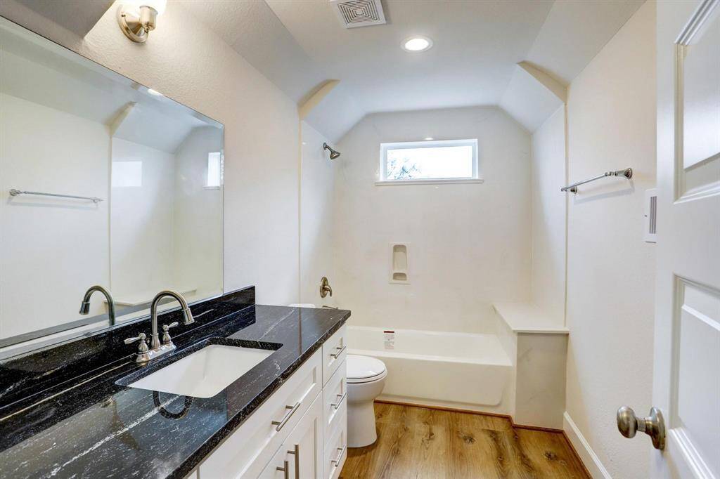 Full upstairs bathroom conveniently located near both bedrooms.