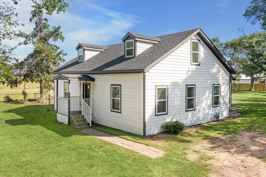 Welcoming front entry with updated siding/roof/paint.