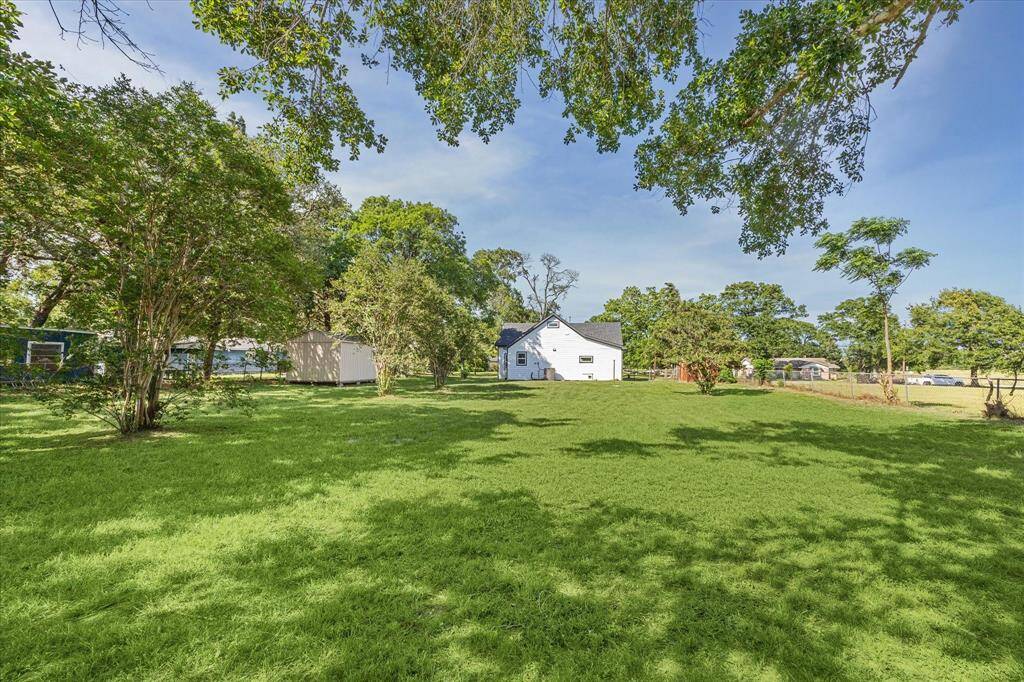 Spacious backyard with room for entertaining, pets, or a play area.