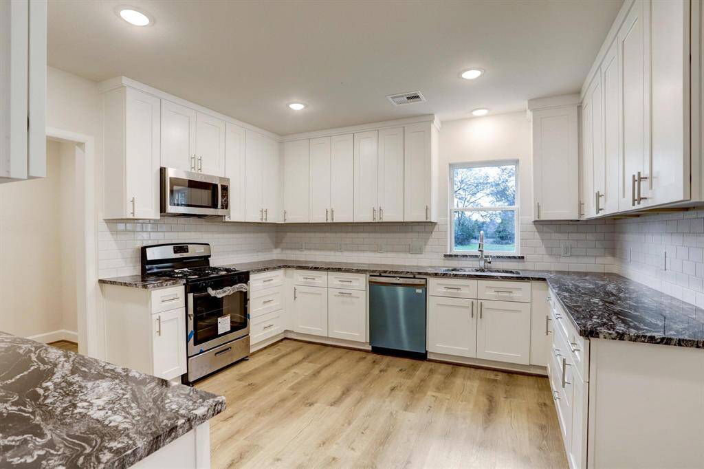 Open living area featuring beautiful, durable vinyl flooring that flows throughout the home.
