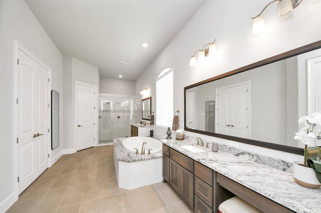 The sellers invested an additional 25,000 dollars with the builder to expand the primary suite—including the bedroom, bathroom, and walk-in closet—creating a more spacious and comfortable retreat.