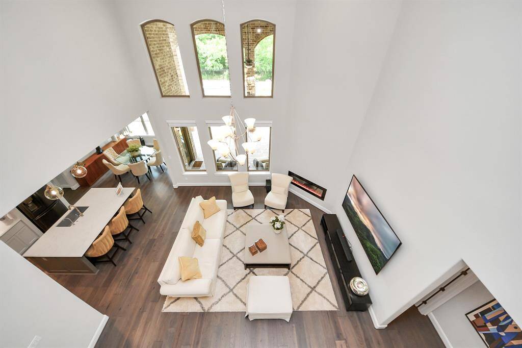 Spectacular second-floor overlook into the elegant living room below.