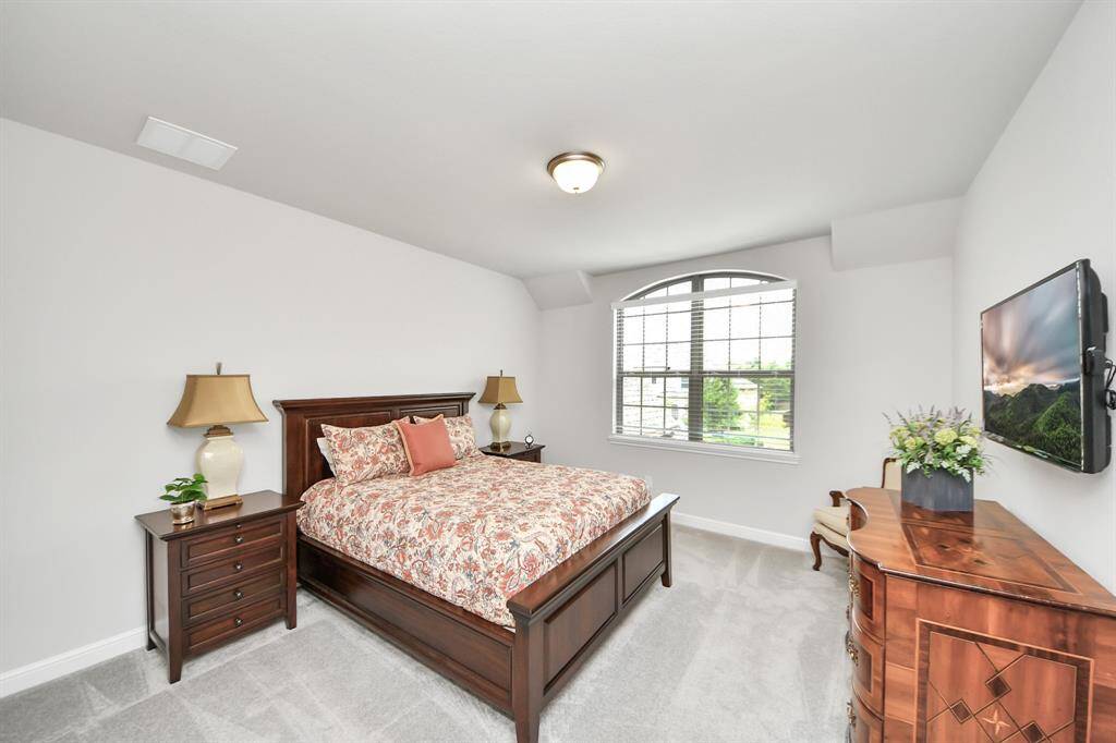 Another bright and inviting secondary bedroom with a large window and plush carpeting.  Like all the other 3 secondary bedrooms, it has its own en-suite bathroom.