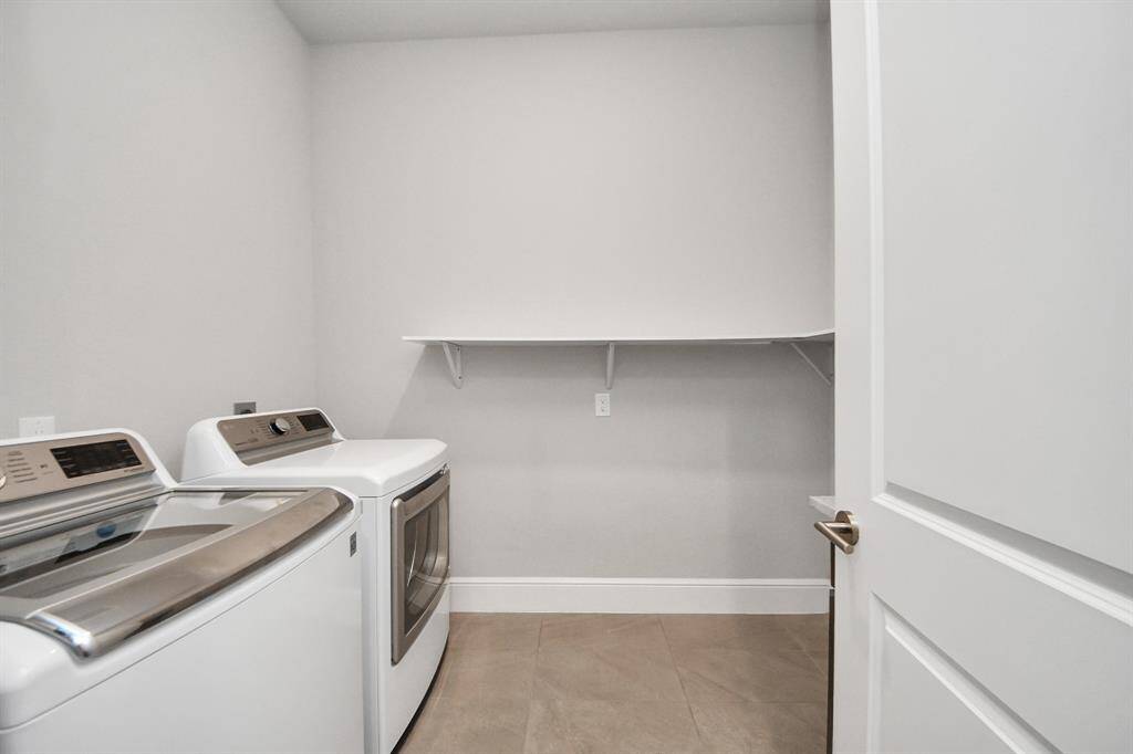 Laundry room is located on the first floor.  It has a sink and small cabinet and a shelf for convenience.