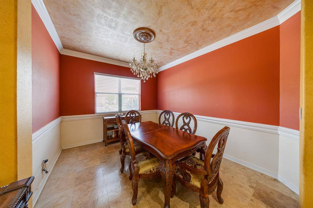 Formal dining room with warm tones, offering an elegant space for intimate meals and special gatherings.