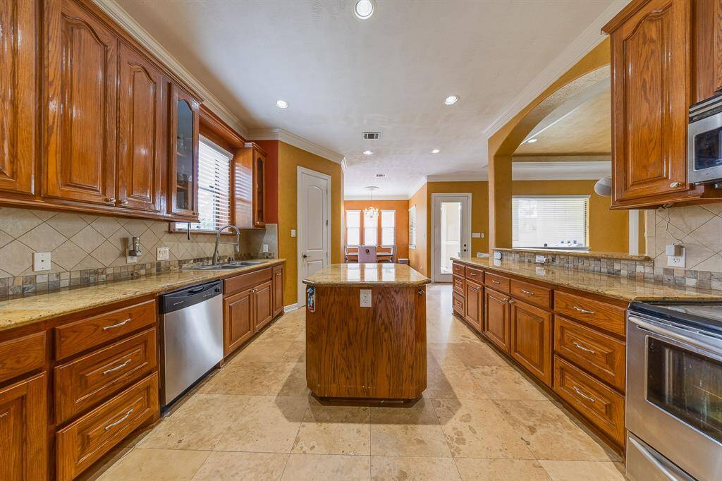 Spacious kitchen with plenty of counter space, modern appliances, and an open layout perfect for cooking and entertaining.