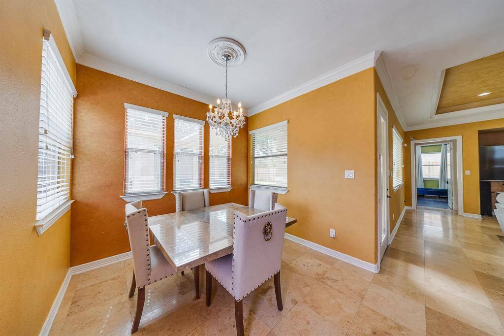 Warm light pours into the breakfast room, creating a bright and inviting space to start your day.