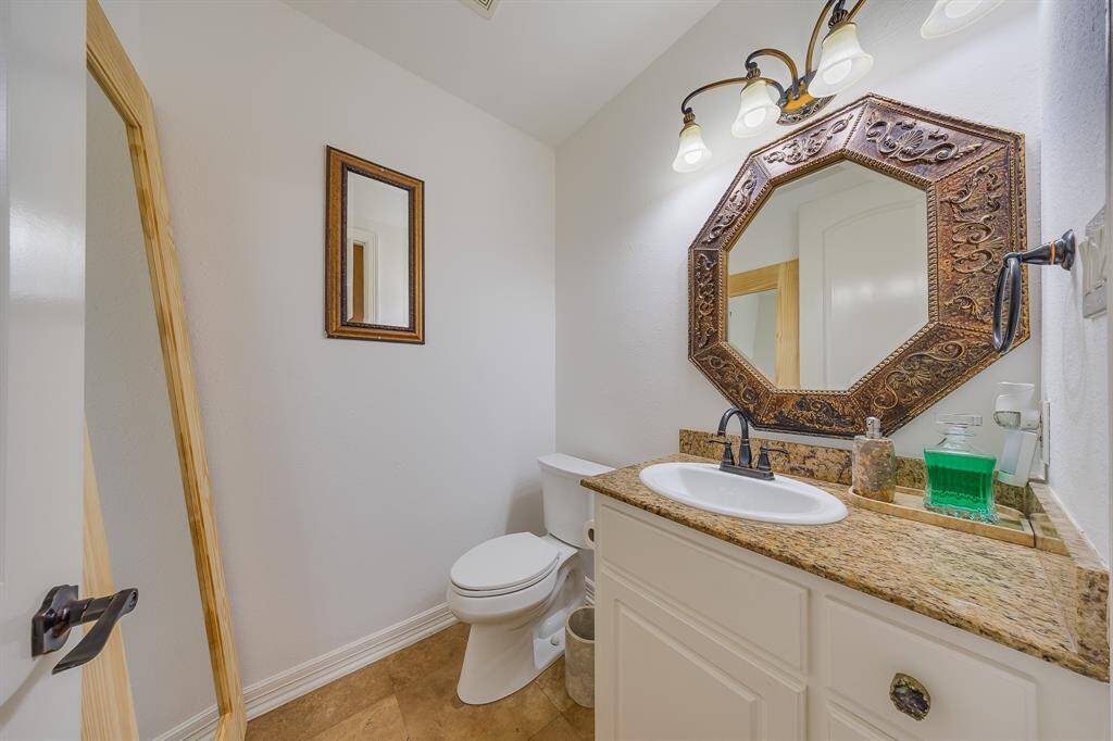 Convenient half bath with stylish finishes, perfect for guests and everyday use.