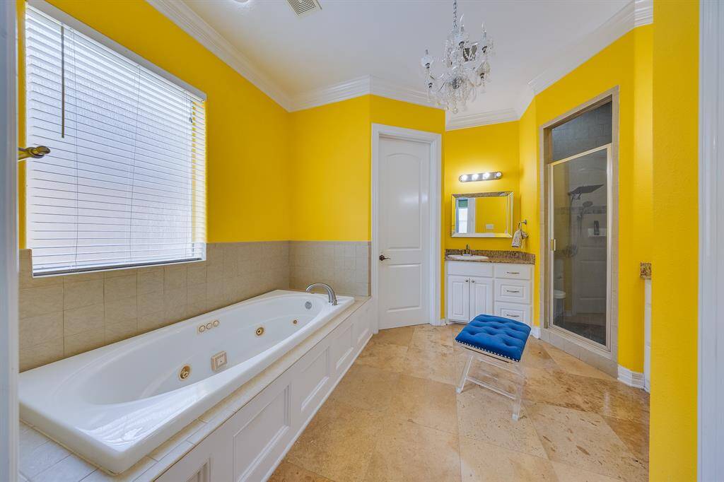 Huge primary bath with a private toilet, offering ultimate comfort and privacy for a relaxing, tranquil experience.