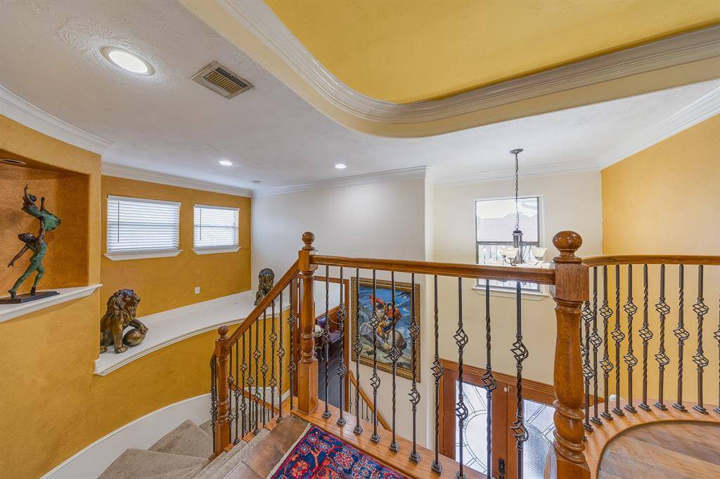 Beautiful details along the staircase, adding character and charm as you ascend to the upper levels of the home.