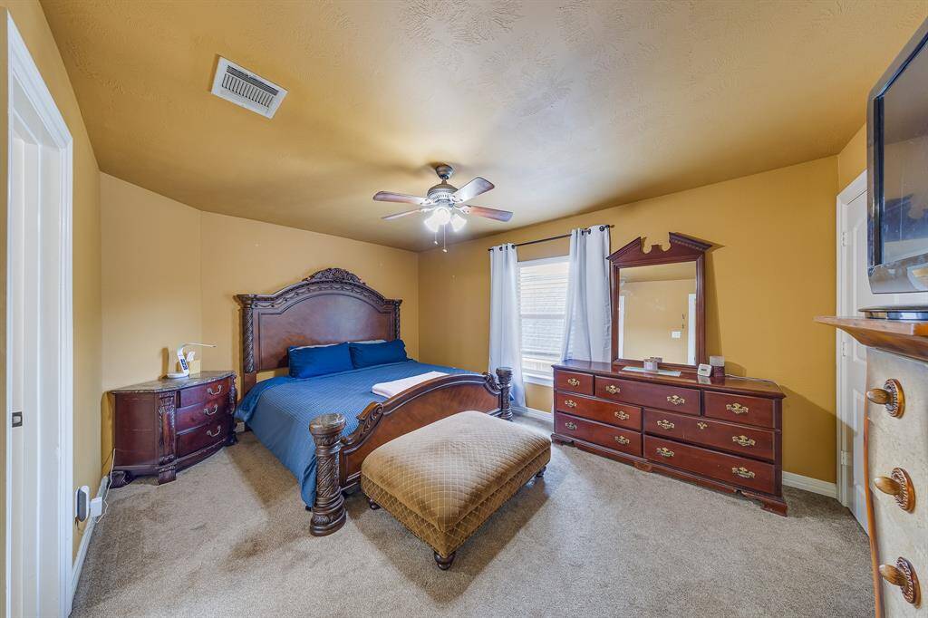 Generously sized bedroom #2, offering plenty of space for furniture and a comfortable living area.
