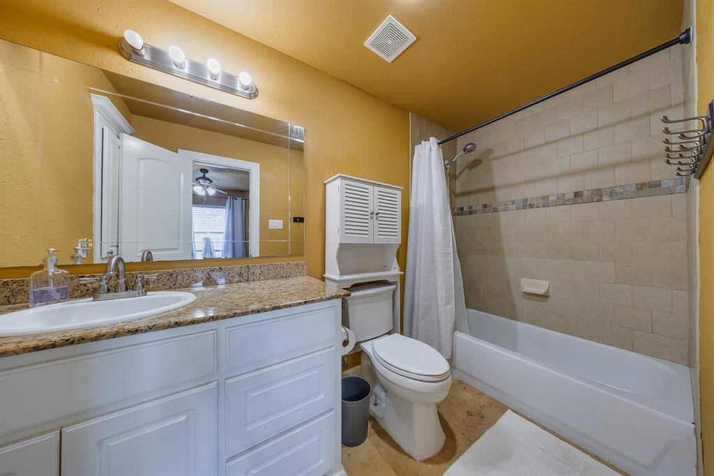 Bathroom with a convenient shower and tub combo, offering flexibility for both quick showers and relaxing baths.