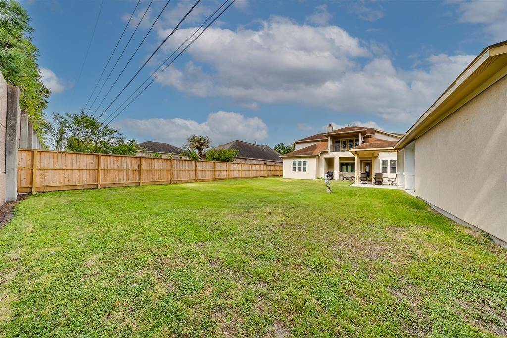 Spacious backyard offers a blank canvas—perfect for customizing your dream outdoor space or adding future features.