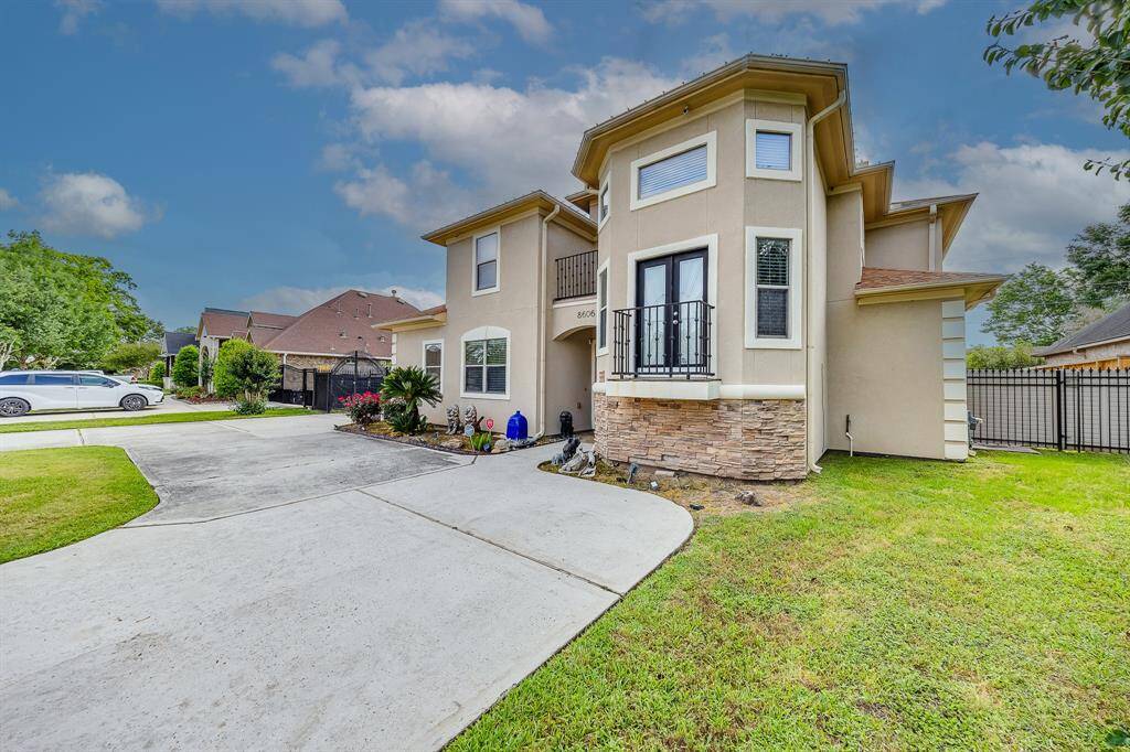 Charming stucco facade combined with brick accents, offering a stylish and durable exterior with timeless appeal.