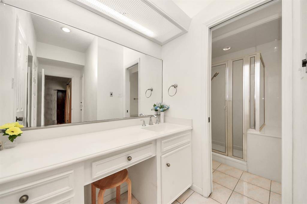 Separate vanities and two sinks give everyone their space.