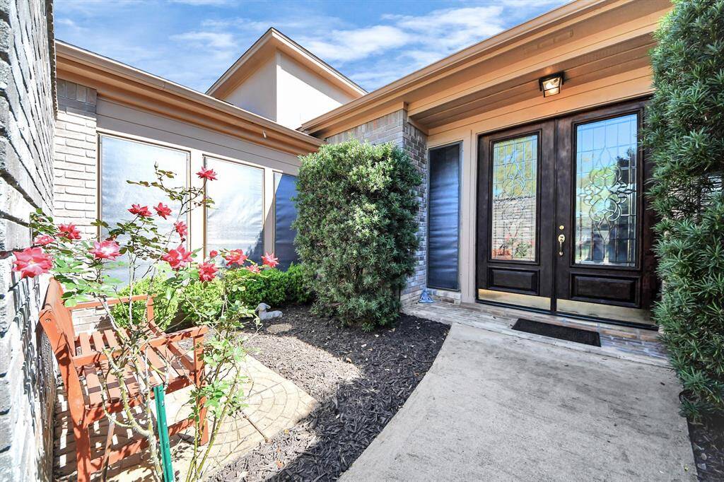 Gated courtyard entry has electro-magnetic lock for added security.