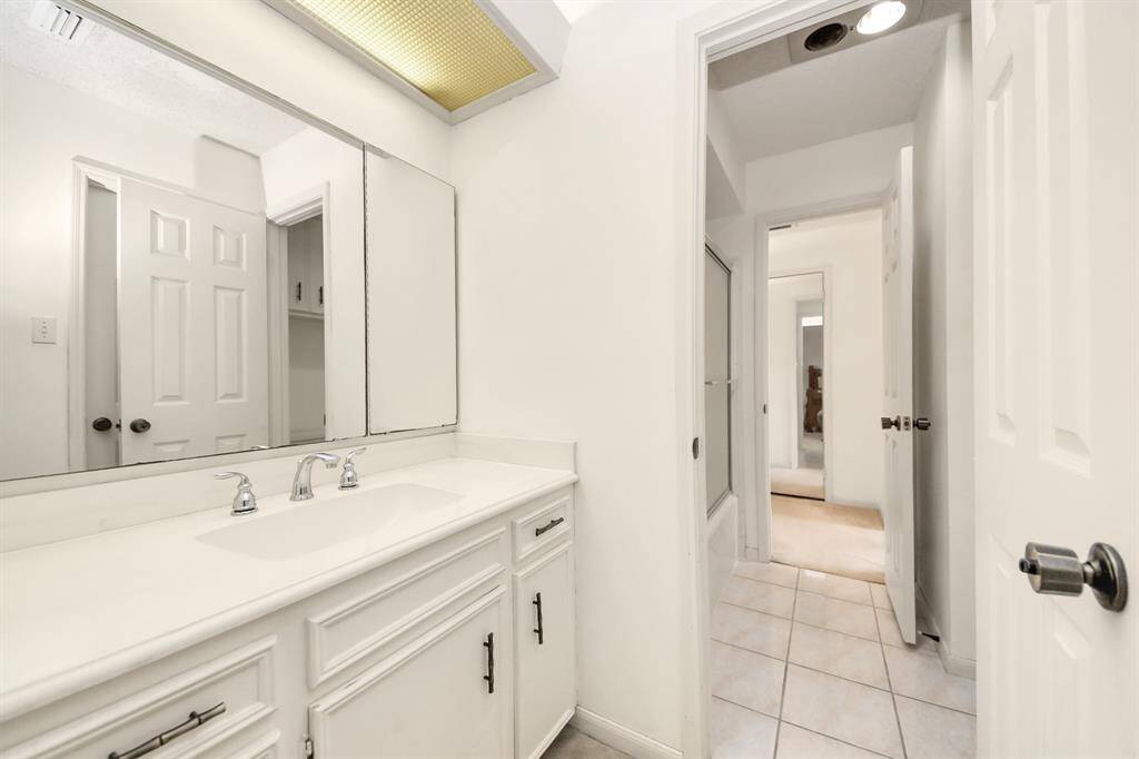 Jack and Jill style bath upstairs shares tub/shower combo.