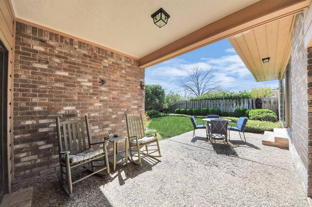 Covered patio is accessible from the primary suite as well as the breakfast room.