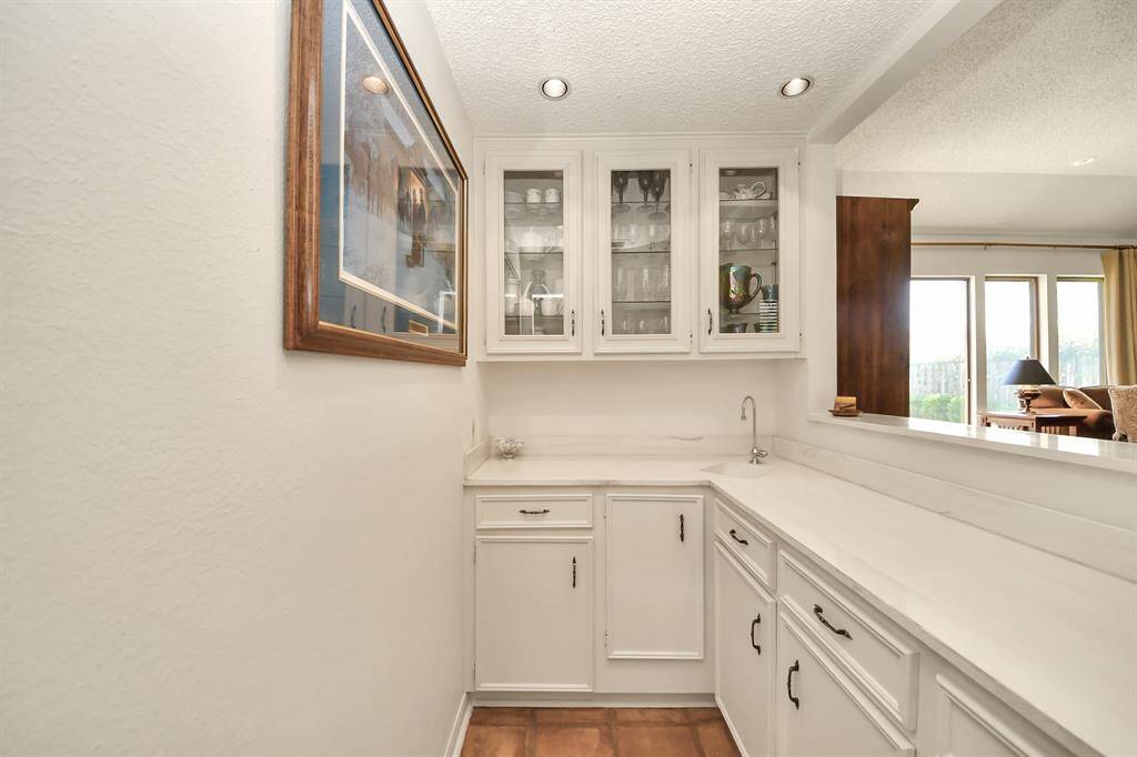 Wet bar is perfect for entertaining! Or reformat the space for a wine or whiskey cave.
