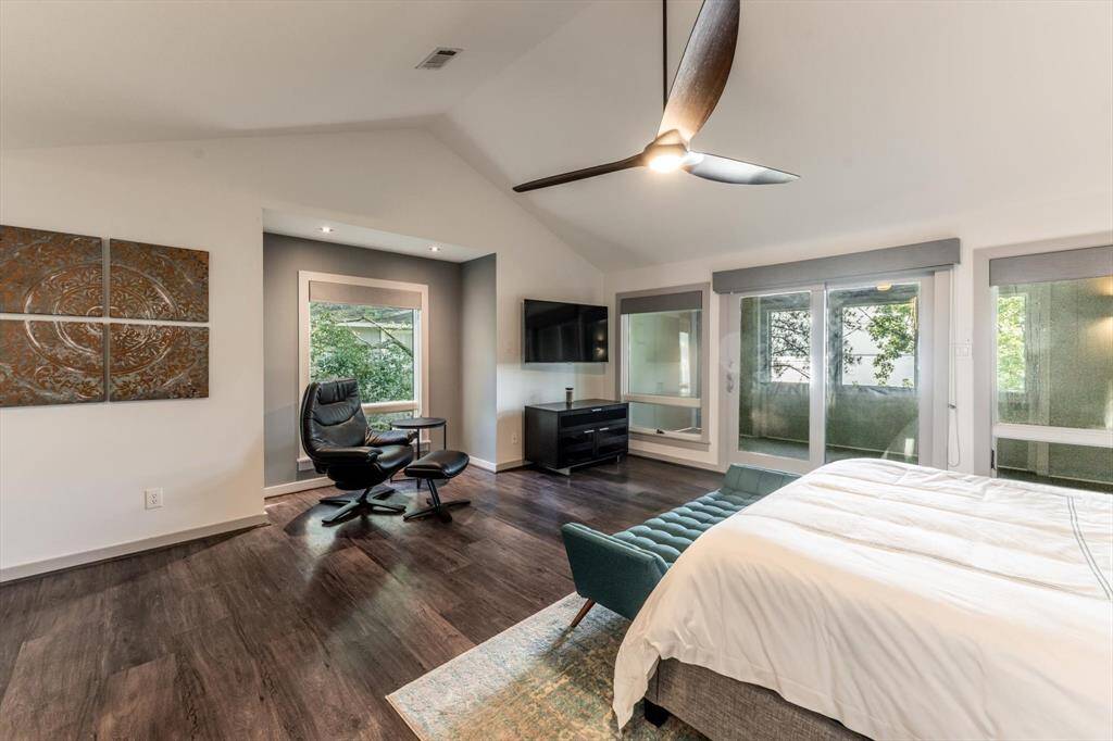 Another angle of the serene primary suite. This room also offers a cozy reading nook and direct access to your private screened in patio. This space is equal parts restful and refined! Views from every angle!