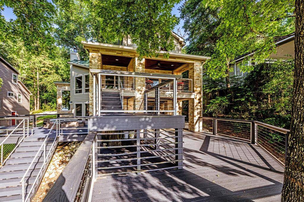 Multi-level Trex decks, seamless transitions, and lake views from every angle.