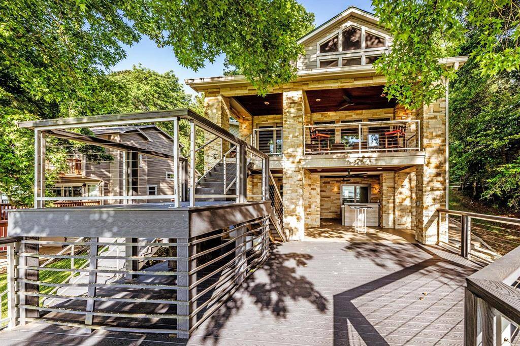 Bold design meets natural beauty in this tiered lakeside escape,Crafted with limestone and infused-hardy, this beautifully tiered exterior blends natural elegance with long-lasting durability—offering both visual impact and low-maintenance luxury.