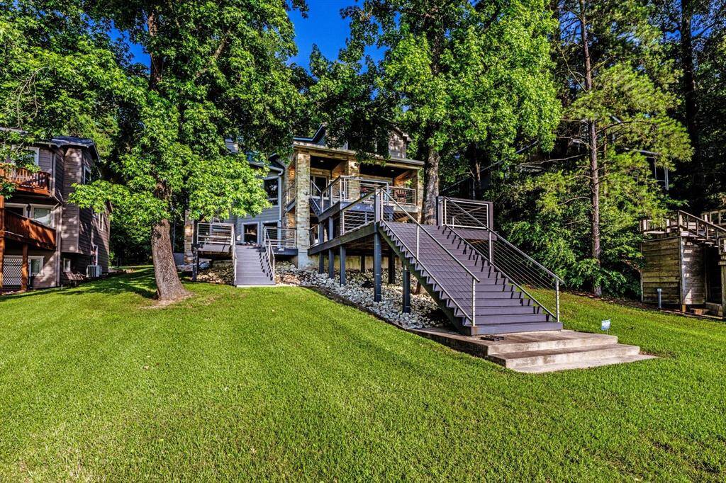 From the water to the treetops—this home makes the most of every inch