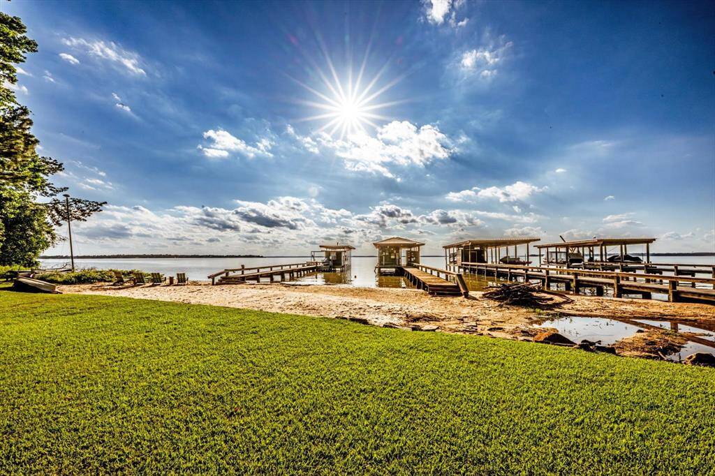 Golden hour hits different on your private beach and boathouse.