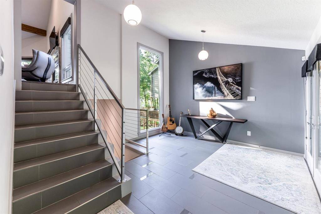 From the stylish and bright entryway with modern accents leads to the main living area, or down to your Texas sized gameroom with a private guest suite!