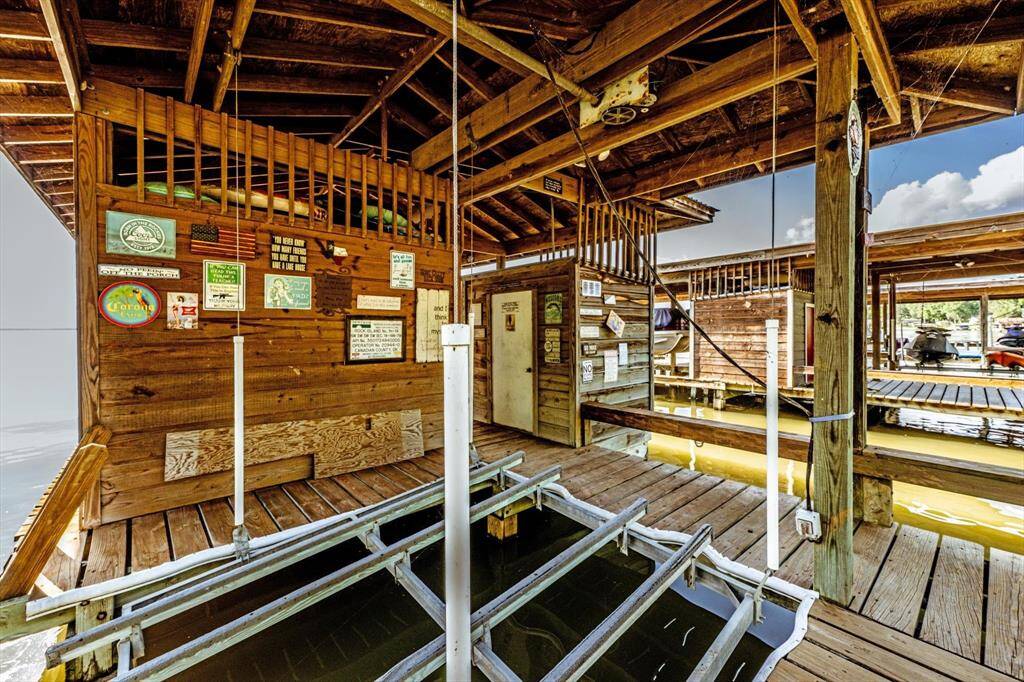 A fully appointed boathouse featuring dual jet ski lifts, refined storage, and a seamless blend of form and function.