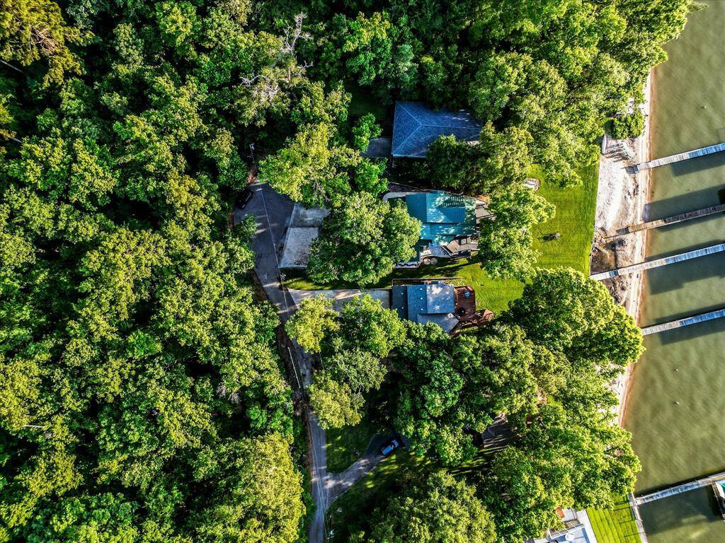 Wrapped in water and wild beauty—this estate shares its shoreline with unspoiled land.