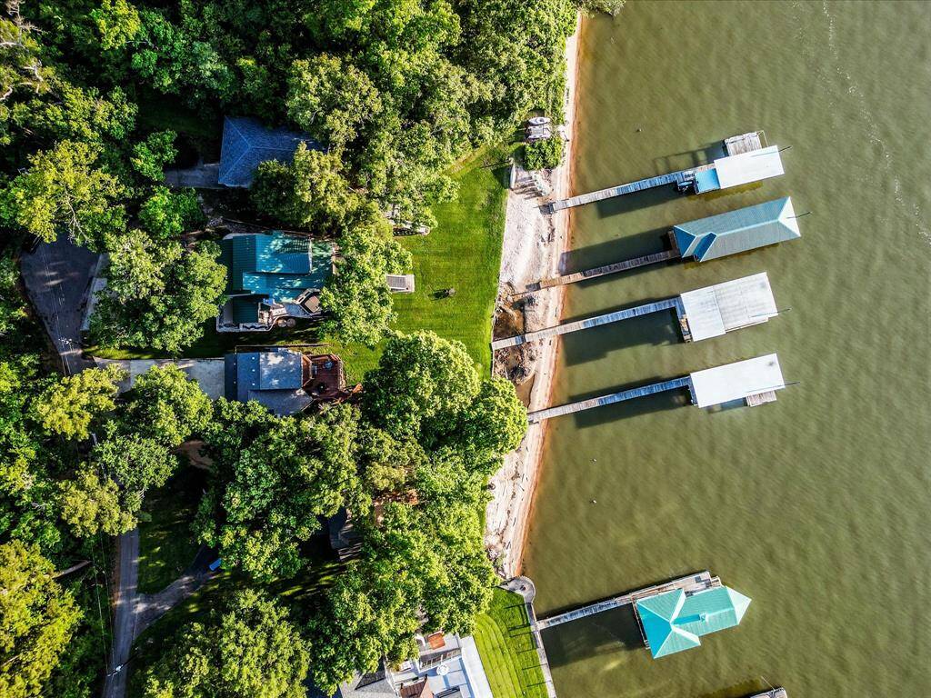 A rare sandy natural beach and no bulkhead to care for, with direct access to Lake Livingston. Framed by forest, docked in luxury, and surrounded by nature.