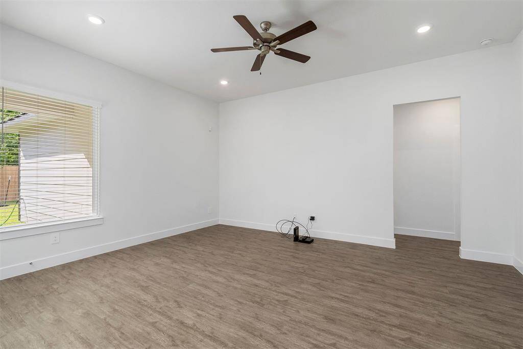 Family room with high ceilings and ceiling fan!