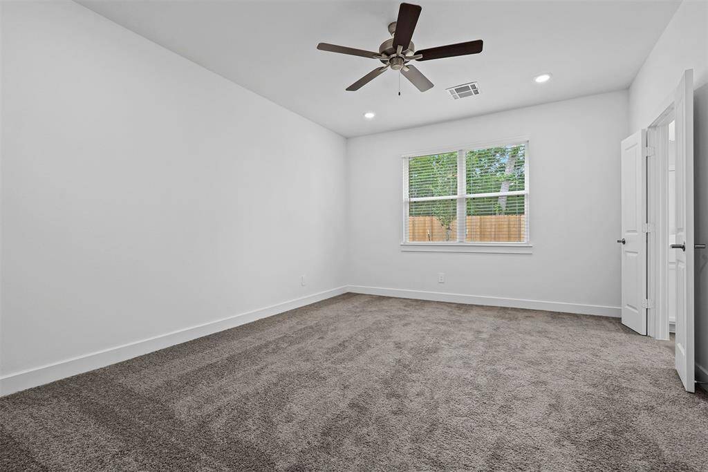 Master bedroom with high ceilings and ceiling fan!