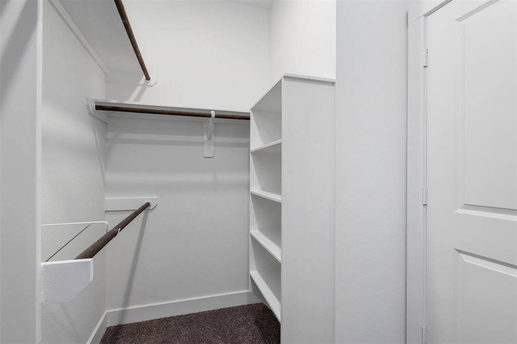 Master closet with built-in storage for shoes, etc.