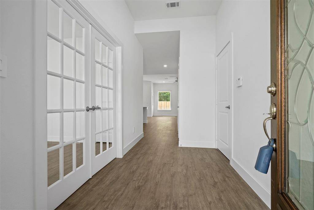 Immediately entering the front door there is a home office to the left with French doors!