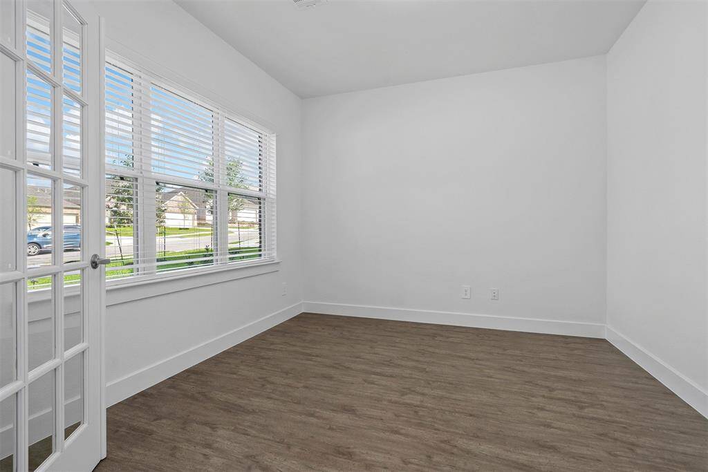 Home office/study with French doors and closet up front!