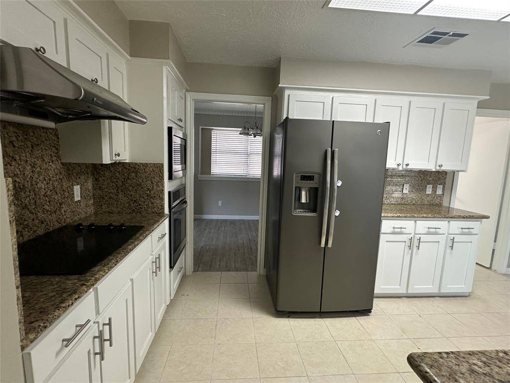 Door into the dinning room and the right  door goes into the utility room , pass the utility room into the garage.
