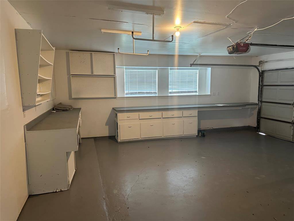 2 car garage with beautiful windows and plenty of storage.