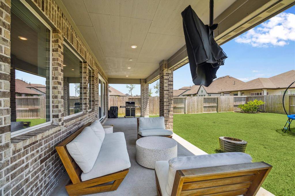 The upgrades don't stop just because we step outside!  Extended patio allows for additional seating options and grilling space.  Television mount can stay too.